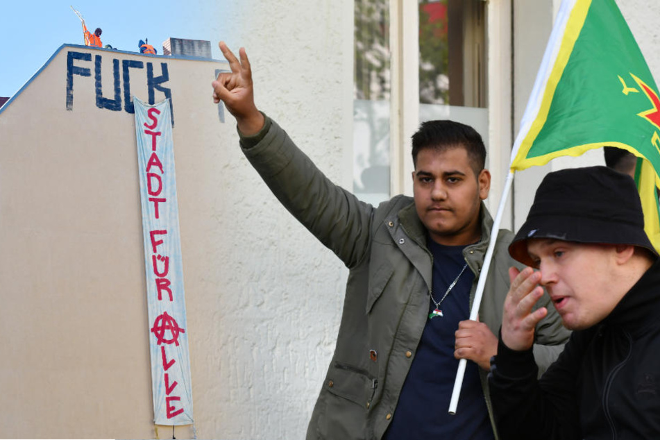 Während linke Aktivisten ein Banner mit der Aufschrift "Stadt für alle" an einer Hauswand ausrollen, zeigt ein kurdischer Demonstrations-Teilnehmer ein Handzeichen.
