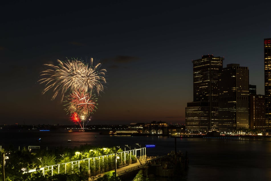 Fireworks lit evening skies at New York Harbor in celebration of reaching 70% of New York adults receiving their first dose of the Covid-19 vaccine.