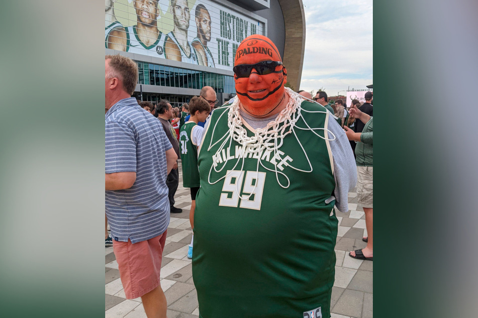 Milwaukee Bucks fans, like Mike McLain (pictured), gathered inside and outside Fiserv Forum stadium in Milwaukee to watch the away Game 5 on giant screens.