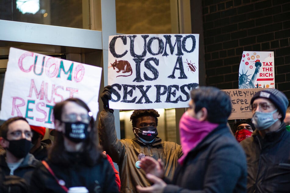 People attend a protest to demand New York Governor Andrew Cuomo's resignation after a third woman accused him of sexual harassment in New York City on March 2, 2021.