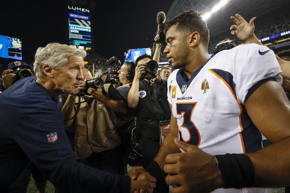 Seattle Seahawks head coach Pete Carroll and Denver Broncos quarterback Russell Wilson exchange words following Seattle's win in the season opener.