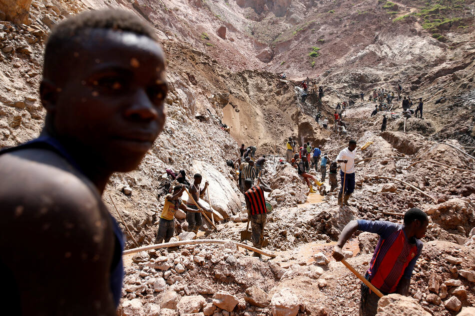 Laborers work at an open shaft of the SMB coltan mine near the town of Rubaya in the Eastern Democratic Republic of Congo.