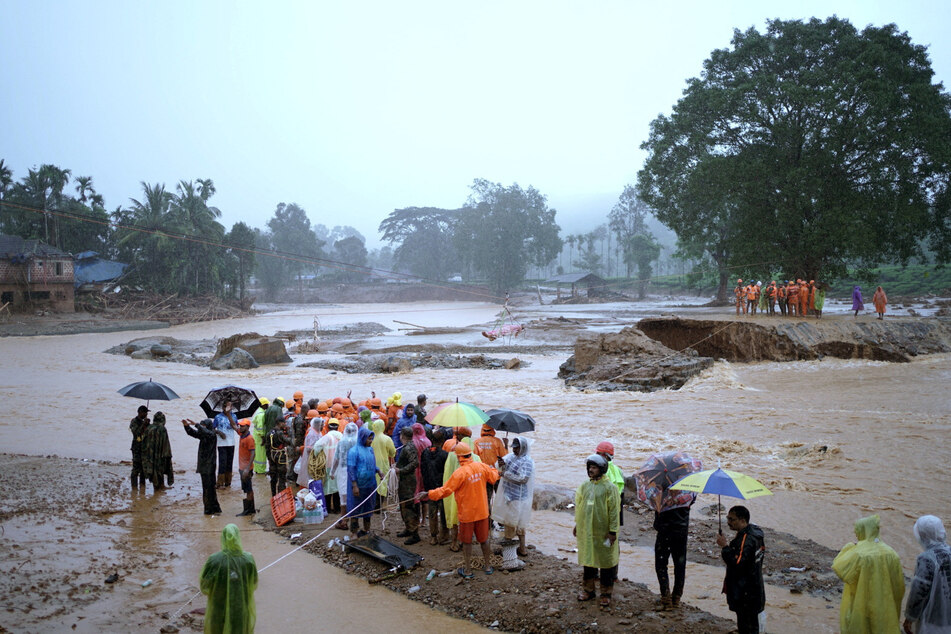 Members of rescue teams conduct an operation at a landslide site in Wayanad, in the southern state of Kerala, India.