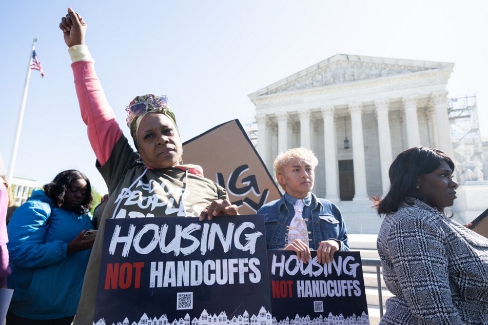 Demonstrators rally outside the Supreme Court in Washington DC in support of housing justice in the case of City of Grants Pass v. Johnson which could make it illegal to sleep outside.
