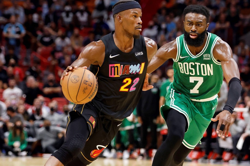 Heat forward Jimmy Butler (l.) is defended by Boston Celtics forward Jalen Brown (r) during the second half of their game on Thursday night.