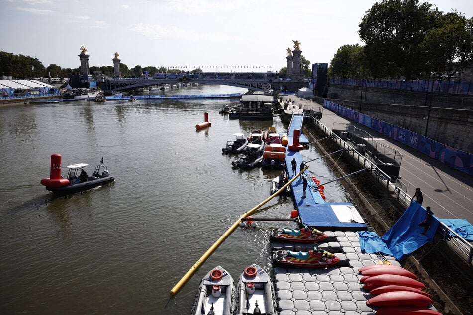 The men's triathlon is scheduled to begin on Tuesday, with the women's competition due to start Wednesday, pending conditions in the River Seine.