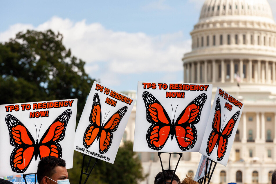 Immigrants' rights activists demand TPS re-designations for Central American countries at a rally in Washington DC.