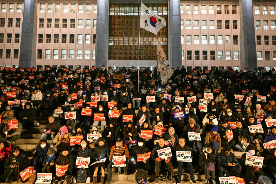 Thousands of people in South Korea flooded the streets, demanding the ouster of President Yoon Seok Yeol, who tried to impose martial law Tuesday.