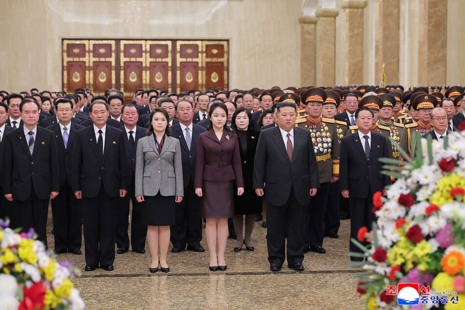 North Korean leader Kim Jong-un's daughter Ju Ae (c.) played a prominent role during a ceremony honoring her grandfather and great-grandfather.
