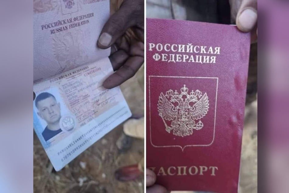 RSF fighters hold Russian ID cards up to the camera.