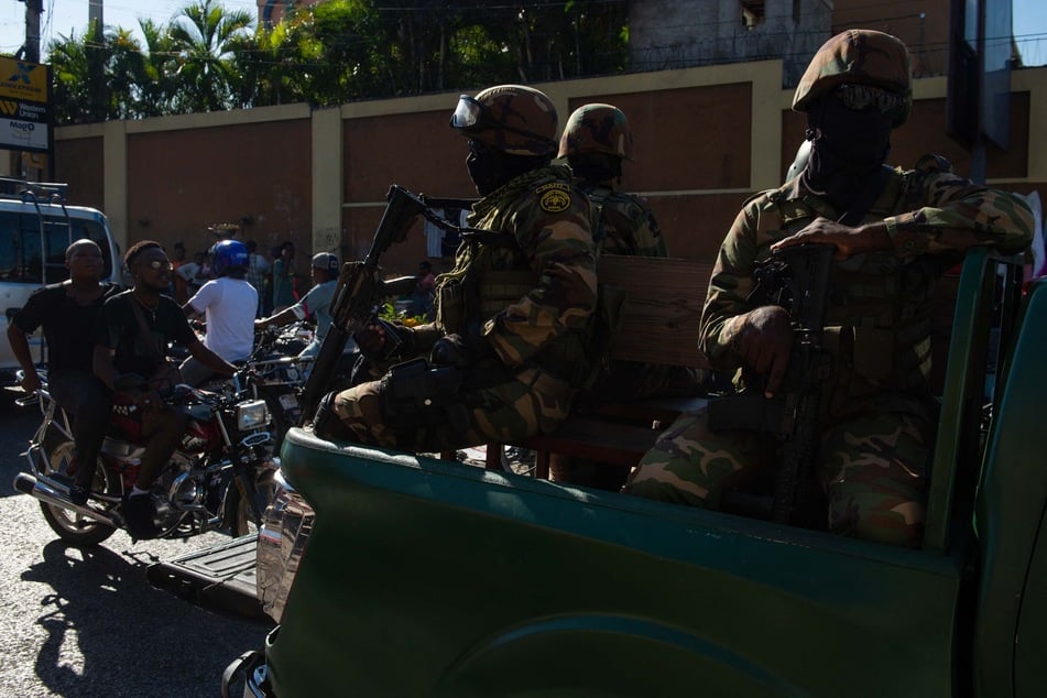 Haitian armed forces patrol the streets of Port-au-Prince after the weekend's horrific violence.