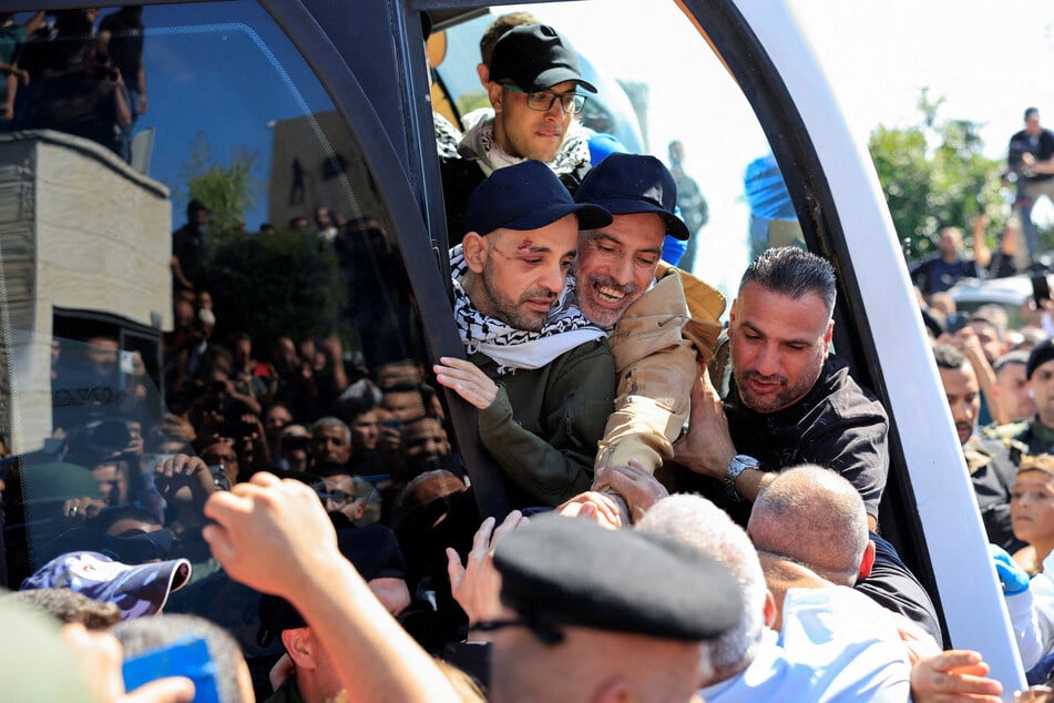 Freed Palestinian prisoners are pictured in a bus after being released from an Israeli jail as part of a Gaza ceasefire deal, in Ramallah in the Israeli-occupied West Bank on October 13, 2025.