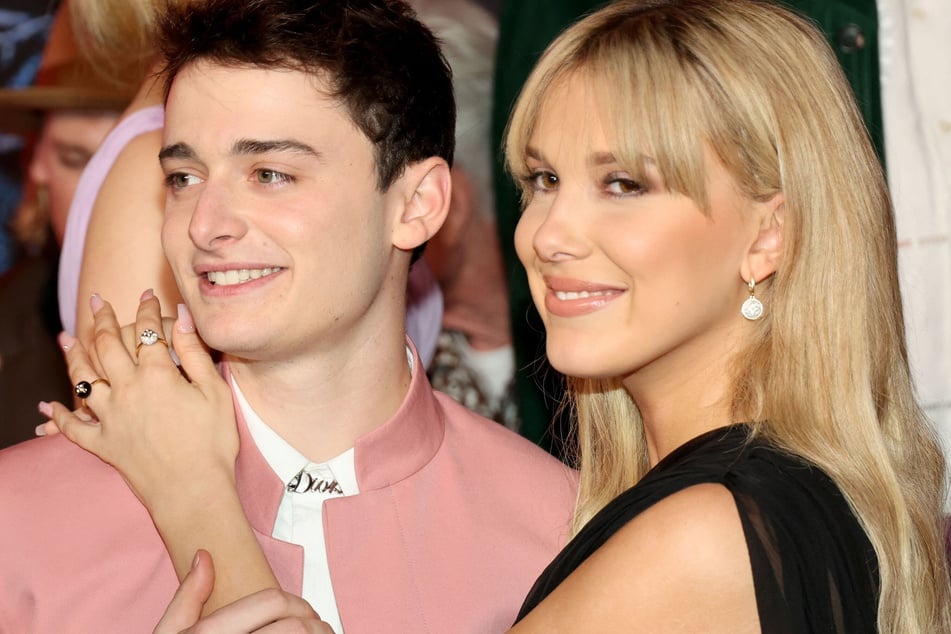 Noah Schnapp (l.) has been revealed to be the godfather of Millie Bobby Brown and Jake Bongiovi's daughter.