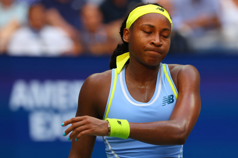 Coco Gauff grimaces after her loss to Emma Navarro in a round of 16 match at the 2024 US Open.