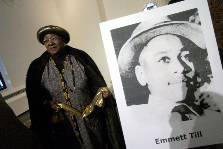 Lillian Jackson, the sister of the late Emmett Till, stands near a picture of her brother in 2004.