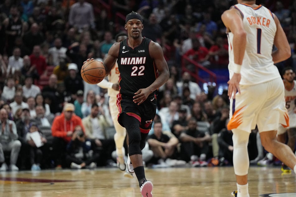 Miami Heat forward Jimmy Butler brings the ball up the court against the Phoenix Suns in the second half at FTX Arena.