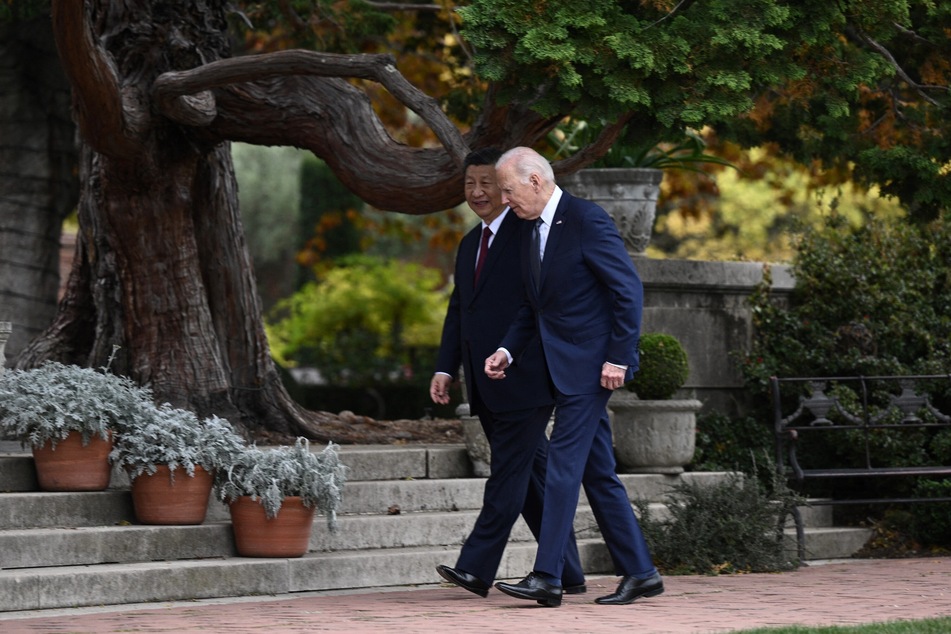 US President Joe Biden walks with Chinese President Xi Jinping as they meet on November 15, 2023.