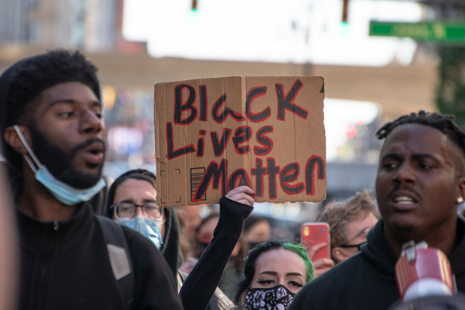 Black Lives Matter protesters rally in Detroit on the one-year anniversary of George Floyd's murder.