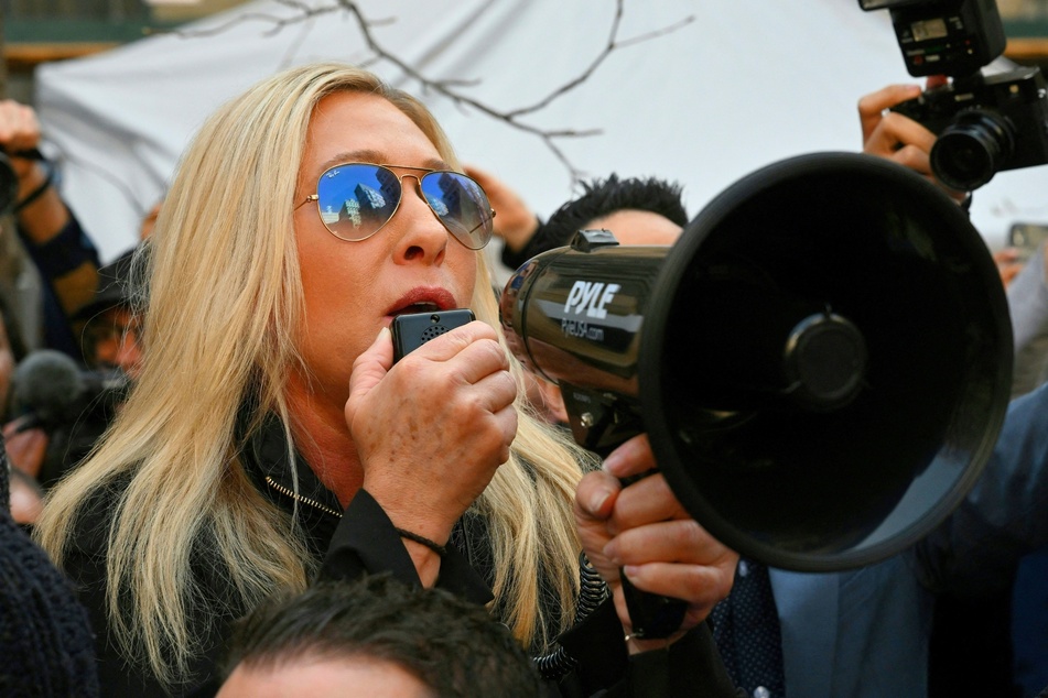 Marjorie Taylor Green speaking to a crowd of protesters as former US President Donald Trump attends his hush money criminal trial in New York City on April 4, 2023.