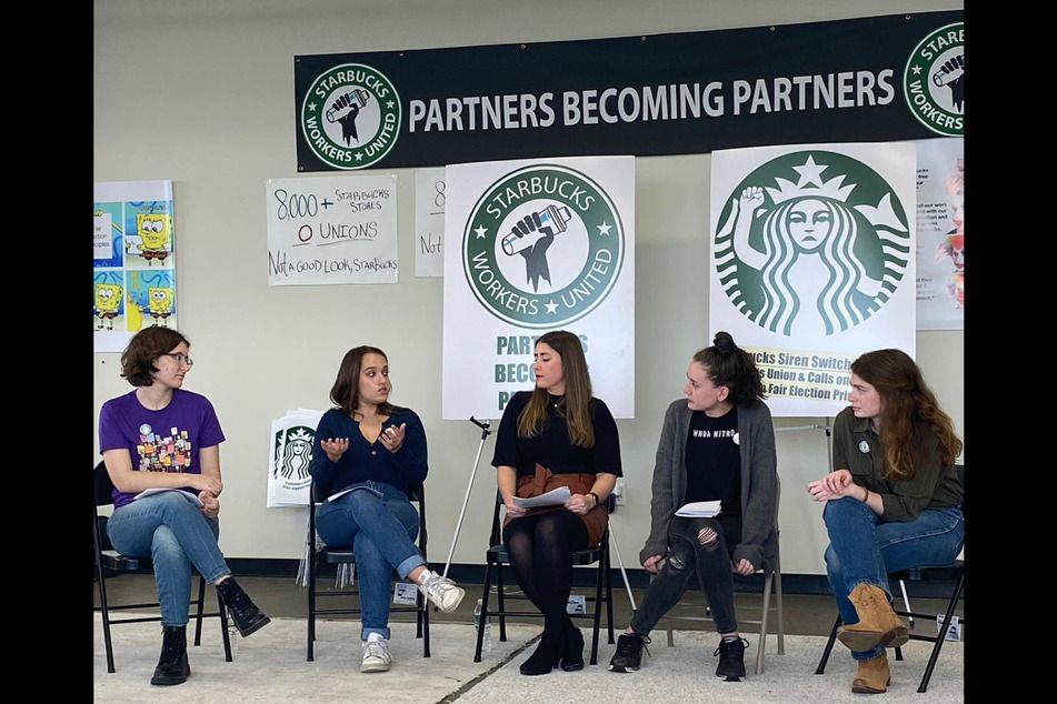 Gianna Reeve (l.) and her partners announce at a press conference that they are filing unfair labor practice charges against Starbucks.