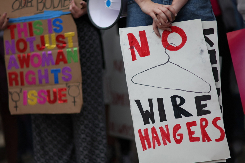 Decorating a sign to carry is an optional but great way to show solidarity.