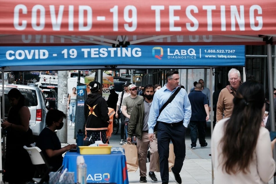 Covid testing sites are still set up on New York City streets, as the city moved to a "high" alert level following a surge of cases in May.