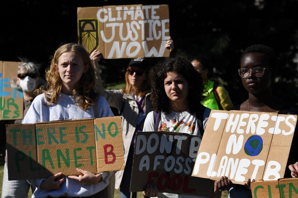 Youth activists protest governments' failure to rein in carbon emissions amid an ever-worsening global climate crisis.