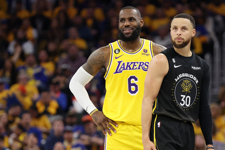 LeBron James (l.) and Steph Curry are among the NBA stars reportedly interested competing at the 2024 Paris Olympics.