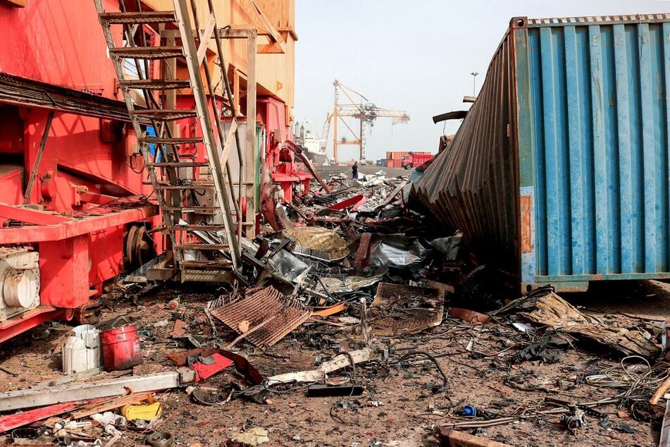 Debris litters a loading dock a day after Israeli strikes on Yemen's Hodeida port.