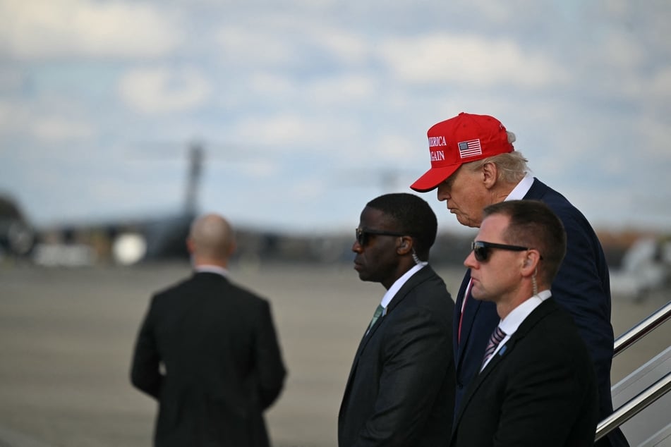 President Donald Trump shared a series of QAnon memes on social media from an account that compared him to Jesus Christ.