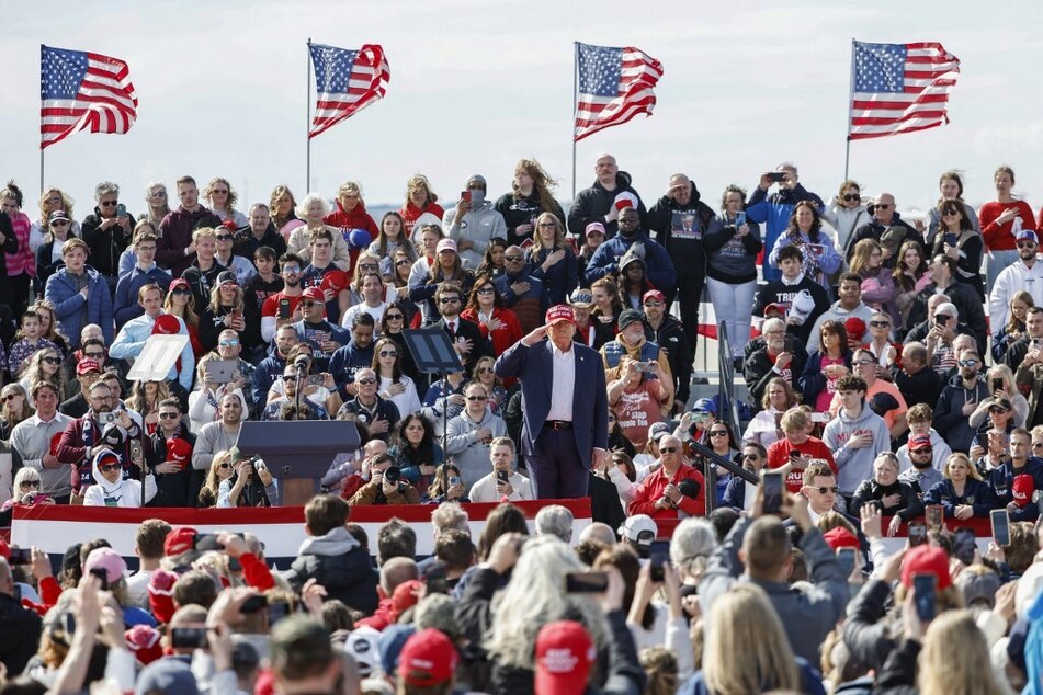 Donald Trump gestures as he arrives for a Buckeye Values PAC rally in Vandalia, Ohio, on March 16, 2024.