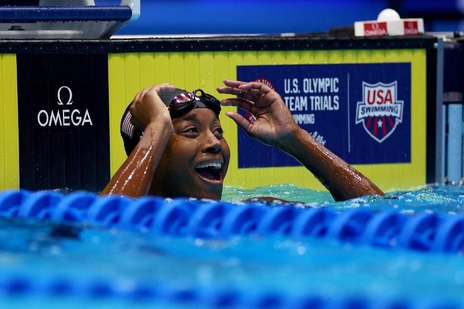 Simone Manuel reacts after winning the Women's 50m freestyle final at the US Olympic Team Swimming Trials at Lucas Oil Stadium.