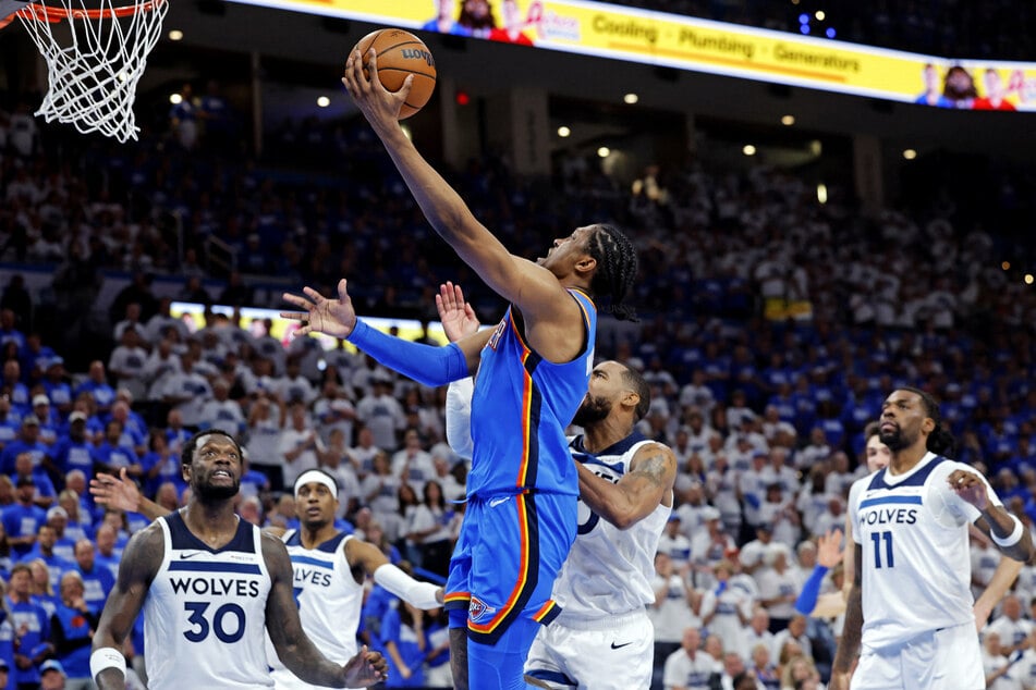 Oklahoma City Thunder forward Jalen Williams drives to the basket against Minnesota Timberwolves guard Mike Conley during the fourth quarter in Game Five of the NBA Western Conference Finals.