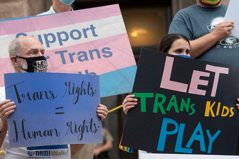 Supporters of transgender rights rallied at the south steps of the Texas Capitol to criticize several anti-transgender bills in the Texas legislature on April 28.