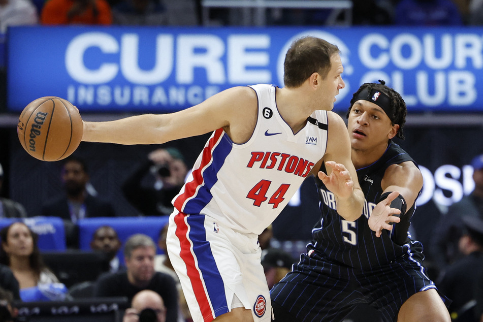 Detroit Pistons forward Bojan Bogdanovic is defended by Orlando Magic forward Paolo Banchero in the first half at Little Caesars Arena.