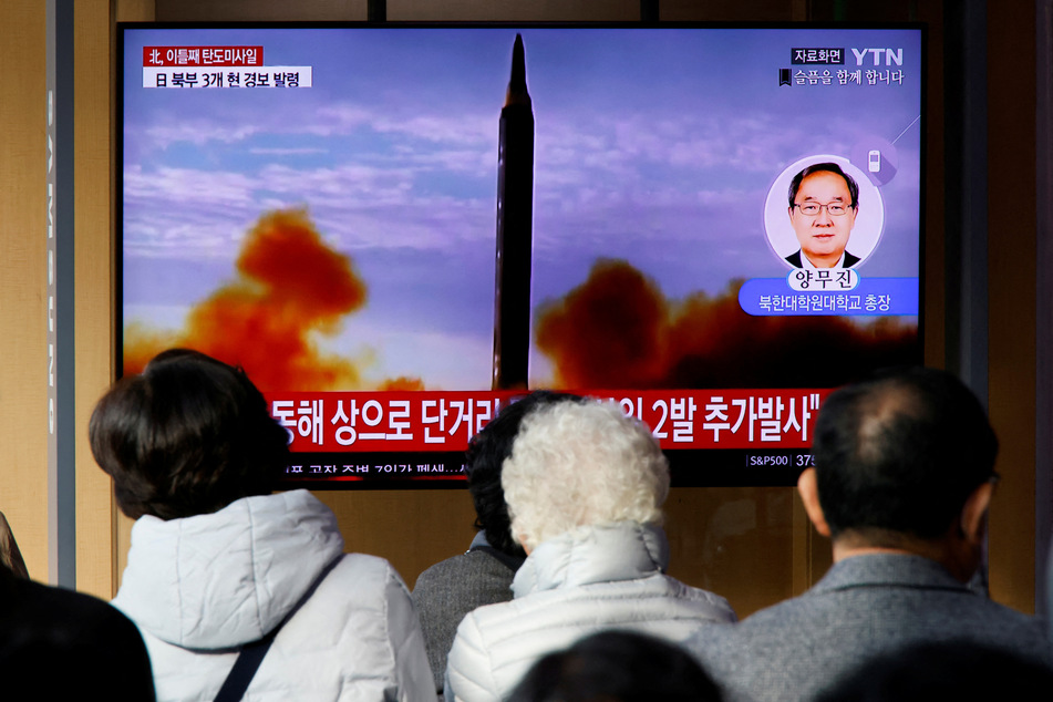 People in Seoul, South Korea, watch a TV broadcasting a news report on North Korea firing a ballistic missile off its east coast.