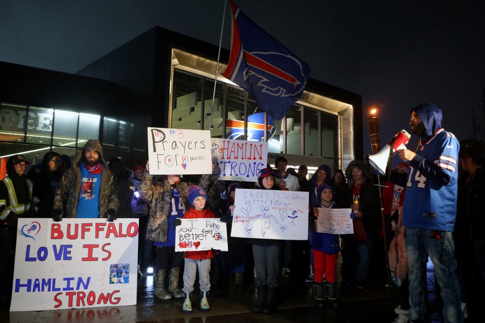 Buffalo Bills fans gathered outside of Highmark Stadium in Orchard Park, New York for a vigil in honor of Damar Hamlin.