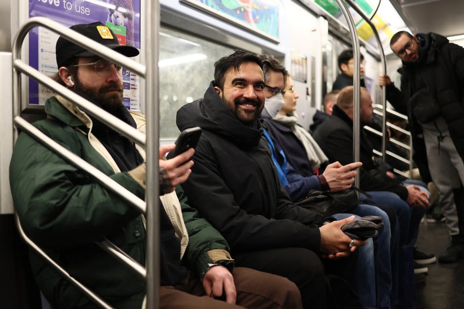 New York City mayoral candidate Zohran Mamdani rides the subway as he prepares to head to Albany.