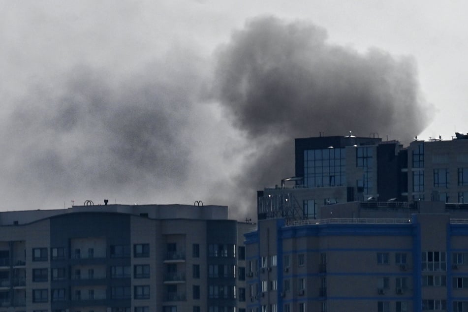 Smoke rises over buildings following a Russian drone attack in Kyiv, on Monday amid the Russian invasion of Ukraine.