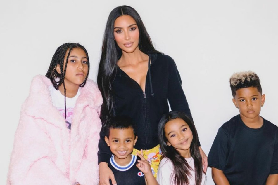 Kim Kardashian (c.) is a mom to four kids.