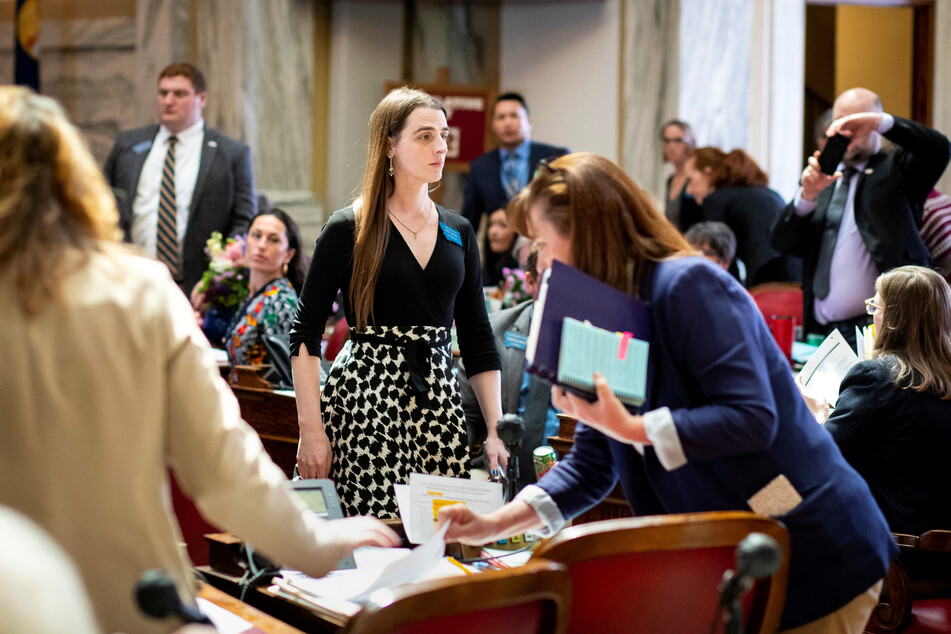 Montana state Rep. Zooey Zephyr walks towards the exit after a motion to bar her from the House chamber was passed.