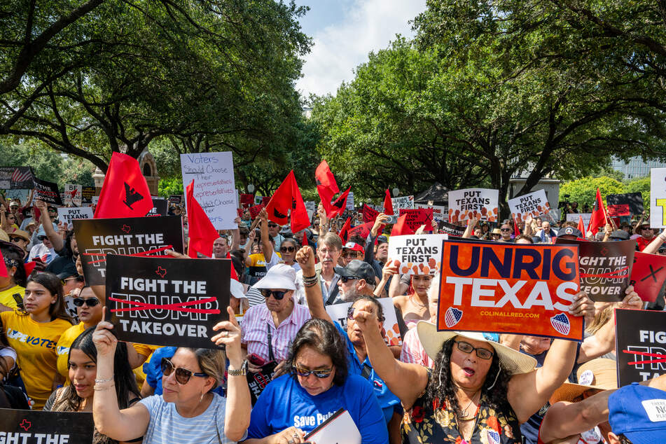People rally during the "Stop the Trump Takeover" demonstration outside of the Texas State Capitol in Austin on August 16, 2025.