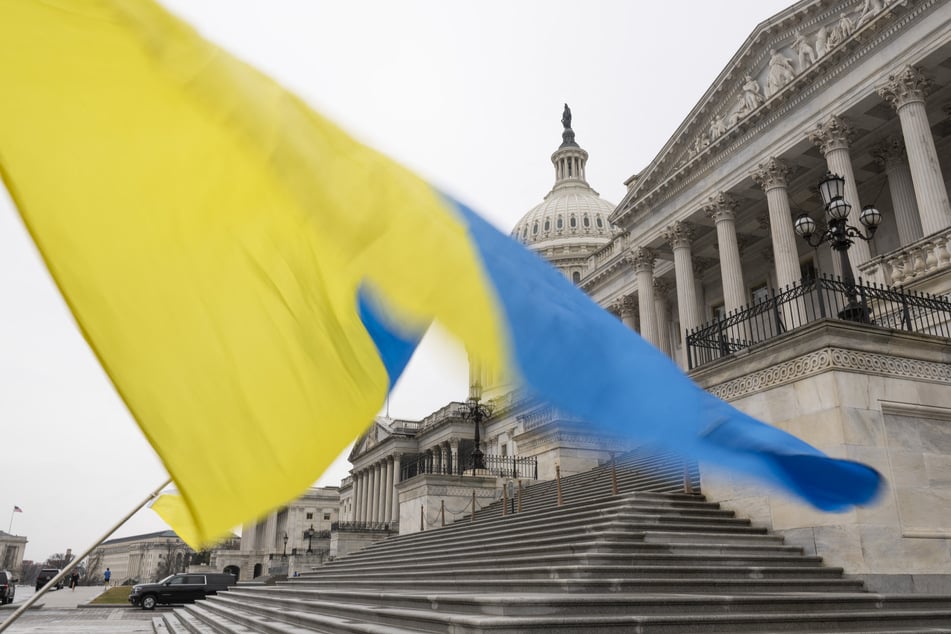 Ukrainian sympathizers fly a Ukrainian flag outside the Senate at the US Capitol on February 11, 2024, in Washington, DC.