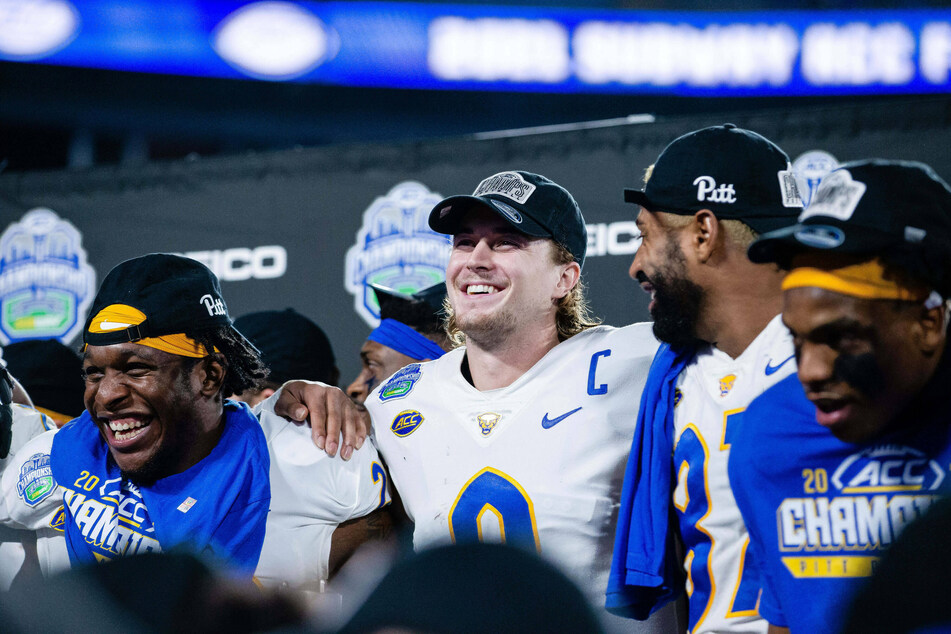 Panthers quarterback Kenny Pickett (c) smiled after defeating Wake Forest in the ACC Championship.