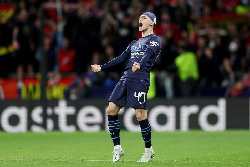 Man City's Phil Foden celebrates at full time as his team knock Atlético Madrid out of the Champions League.