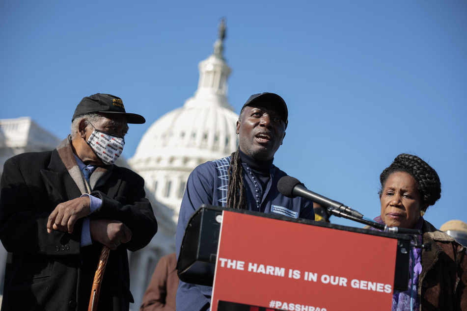 Then National Co-Chair of N'COBRA Kamm Howard (c.) speaks at a press conference on HR 40 on Capitol Hill on November 16, 2021.