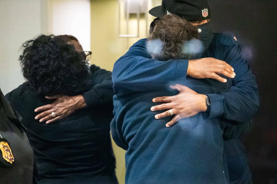 Relatives hug upon learning their loved ones were safe after the FedEx shooting in Indianapolis.