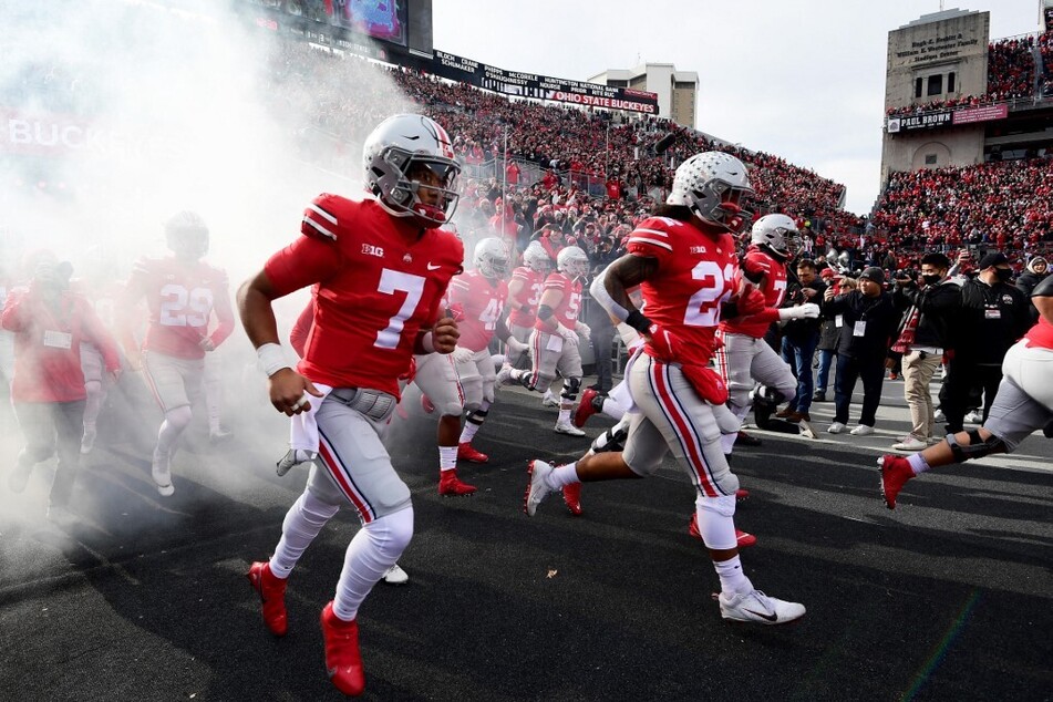 The Ohio State Buckeyes take the field against the Michigan State Spartans in the Horseshoe Stadium.