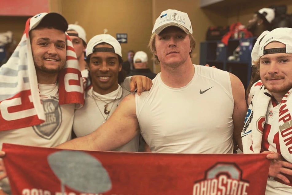 Harry Miller (2nd from r.) and teammates celebrating a conference championship win.