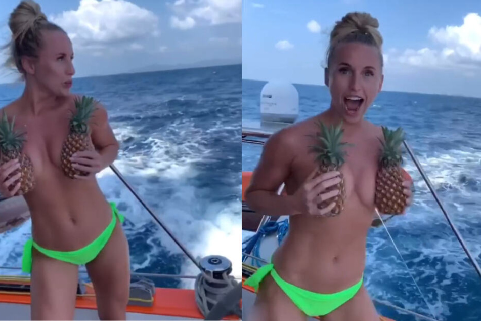 Yulia Ushakova posierte mit zwei saftigen Ananas-Früchten auf einem Boot während ihres Thailand-Urlaubs.